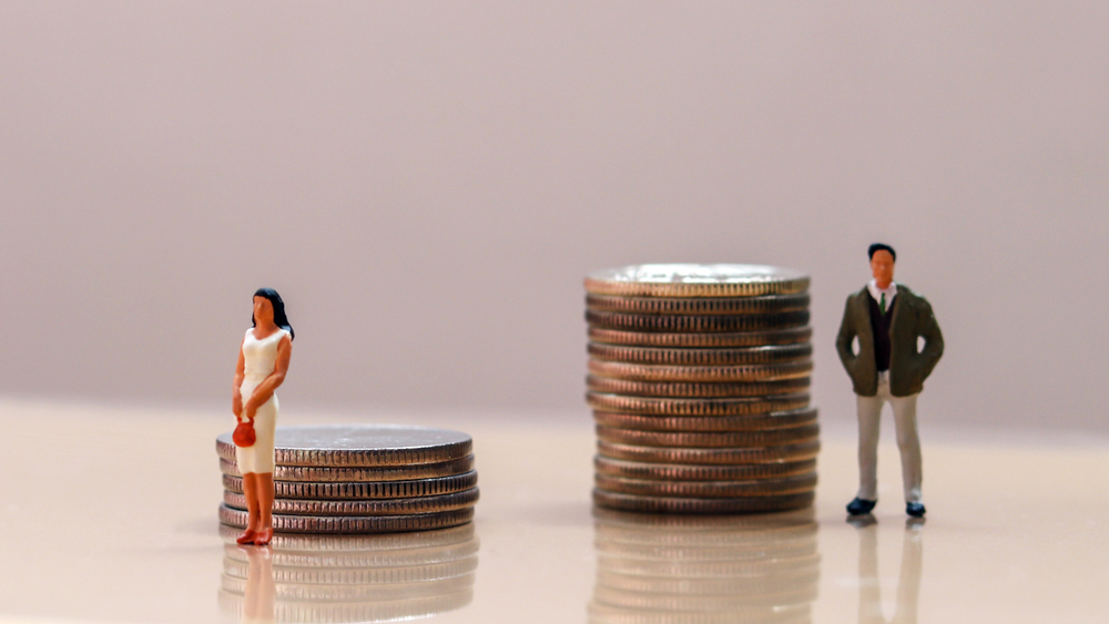 Two figures standing next to stacks of coins, representing the role of equalization payments in an Arizona divorce.